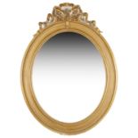 A large Edwardian oval gilt gesso wall mirror