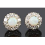 A pair of attractive opal and old cut diamond set earrings