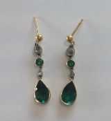 A pair of attractive Edwardian rose diamond and emerald paste ear drops