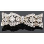An attractive small Art Deco diamond set ribbon brooch