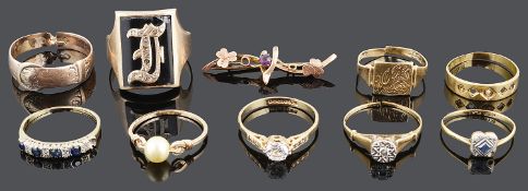 A collection of mainly gold mounted rings