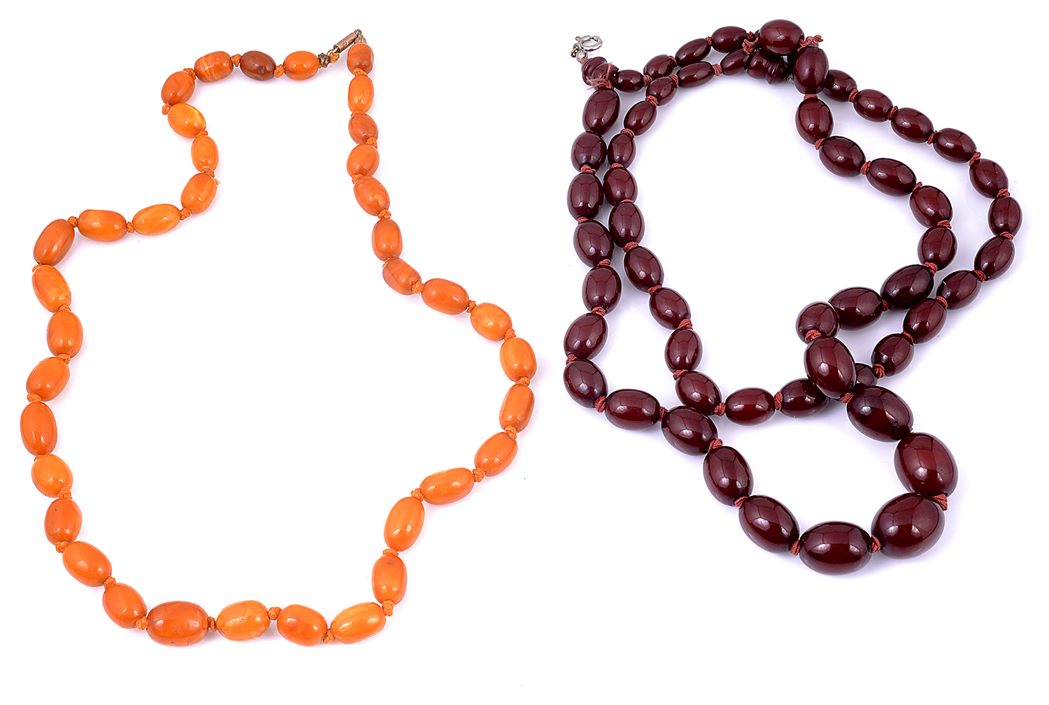 A butterscotch amber necklace and a cherry amber necklace