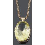 An impressive large gold mounted yellow gem set pendant, c1970