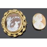 A Victorian ornate carved cameo brooch and another