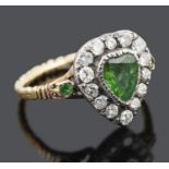 A charming Georgian foil backed green gem and diamond set heart ring