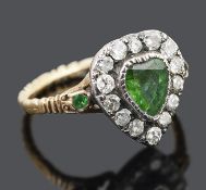 A charming Georgian foil backed green gem and diamond set heart ring