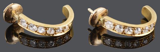 A pair of Continental diamond set half hoop earring