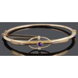 A delicate late Victorian 15ct gold amethyst and diamond set bangle