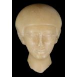 An Egyptian alabaster sculpture fragment of a head.