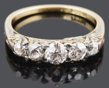 An attractive five stone diamond set half hoop ring, c1920