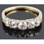 An attractive five stone diamond set half hoop ring, c1920