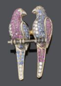 An amusing Victorian style diamond and gem pave set twin parrot brooch