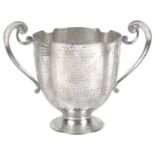 A George V Arts and Crafts silver twin handled cup, London 1912 by Henry Hodson Plante