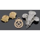 A 9ct gold diamond set twin B.P. commemorative twin shell brooch