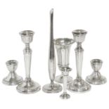 A collection of contemporary silver, candlesticks, vases