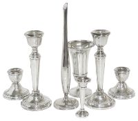 A collection of contemporary silver, candlesticks, vases