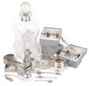 A collection of Victorian and later silver, napkin rings, cruets, cream jug, sugar nips, others