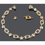 A contemporary 9ct rose and yellow gold fancy scroll link bracelet