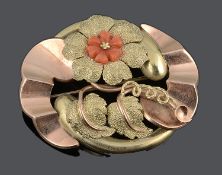 An attractive Continental coral set floral scroll brooch, c1930