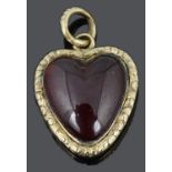 A small Georgian cabochon garnet set heart pendant