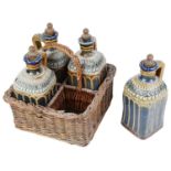 An unusual Doulton stoneware four decanter set in wicker basket