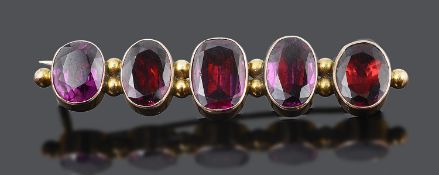 An attractive Georgian foil backed flat cut garnet set bar brooch