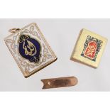 A miniature enamel Quran charm, complete with tiny Quran inside