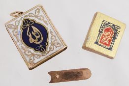 A miniature enamel Quran charm, complete with tiny Quran inside