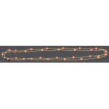 An attractive Continental gold and coral bead neck chain