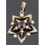 A delicate garnet and seed pearl star shaped pendant