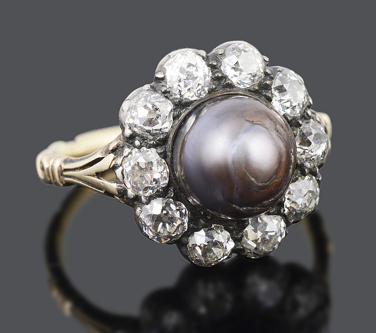 An unusual large late Georgian natural black pearl and diamond set cluster ring