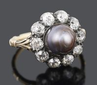 An unusual large late Georgian natural black pearl and diamond set cluster ring