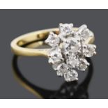 An unusual contemporary tear shaped diamond set cluster ring