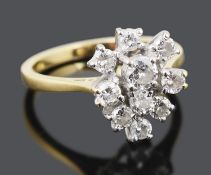 An unusual contemporary tear shaped diamond set cluster ring