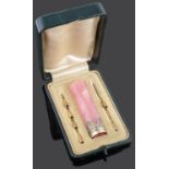 An early 20th century Fr. 18ct. gold mounted rose quartz parasol handle