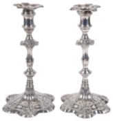 A pair of George II silver candlesticks