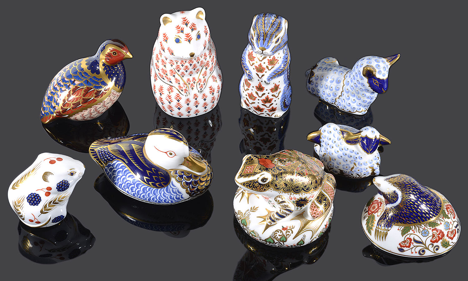 A collection of nine Royal Crown Derby Imari animal paper weights