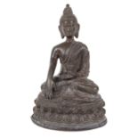 An antique Nepalese small bronze buddha