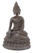 An antique Nepalese small bronze buddha