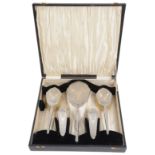 A George V Art Deco silver backed five piece dressing table set