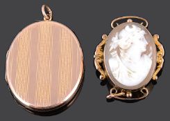 A 9ct gold oval double locket and a Victorian 9ct mounted oval carved shell cameo brooch