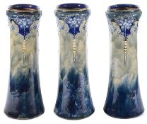 A set of three Royal Doulton stoneware Art Nouveau vases