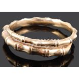 A 9ct gold hinged coiled bamboo effect bangle