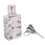 A contemporary silver caged glass scent bottle