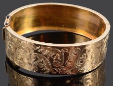 A wide Continental gold hinged bangle