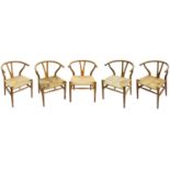 A set of five Hans Wegner (1914-2007) for Carl Hansen & Son Denmark oak CH24 wishbone dining chairs