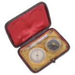 A 19th century brass Fr. pocket barometer, thermometer and compass travelling compendium
