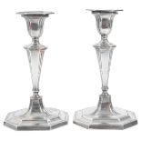 A pair of late Victorian silver candlesticks,