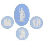 Four early 20th Century Wedgwood blue jasperware plaques