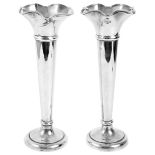 A pair of George V silver spill vases
